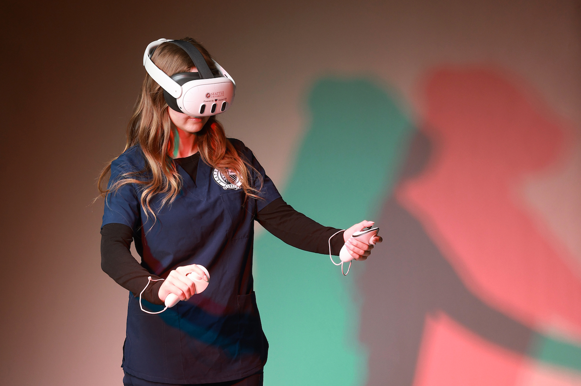 Diagnostic Ultrasound student Inna Leus demonstrates the Vantari VR (virtual reality) equipment for what could become a new standard for ultrasound learning and assessment.