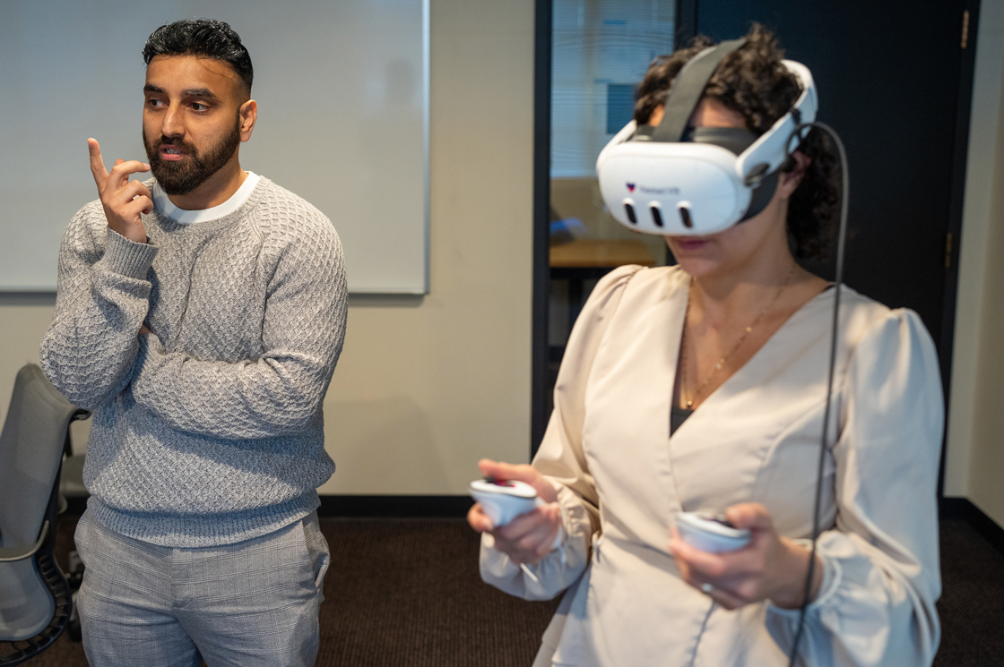 A student wears VR googles using new technology to learn nursing via virtual reality