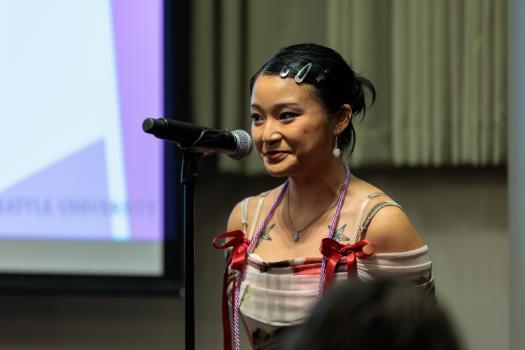 Image of a student speaker at the Lavender Celebration