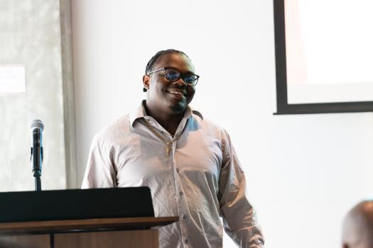 Image of student speaker at Black Rite of Passage