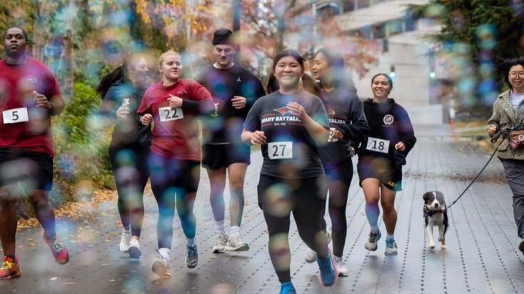 students running outside autumn number on chests