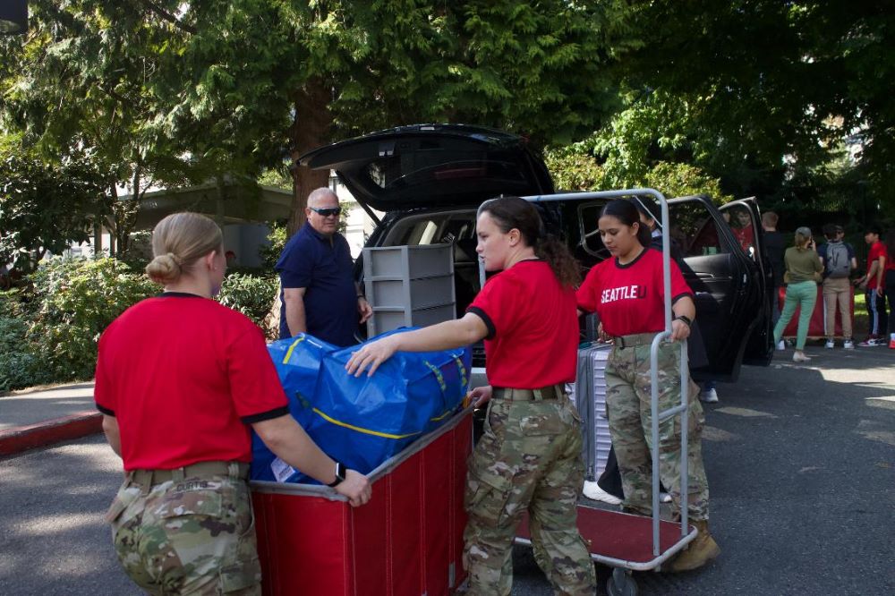 Cadets helping unload a vehicle