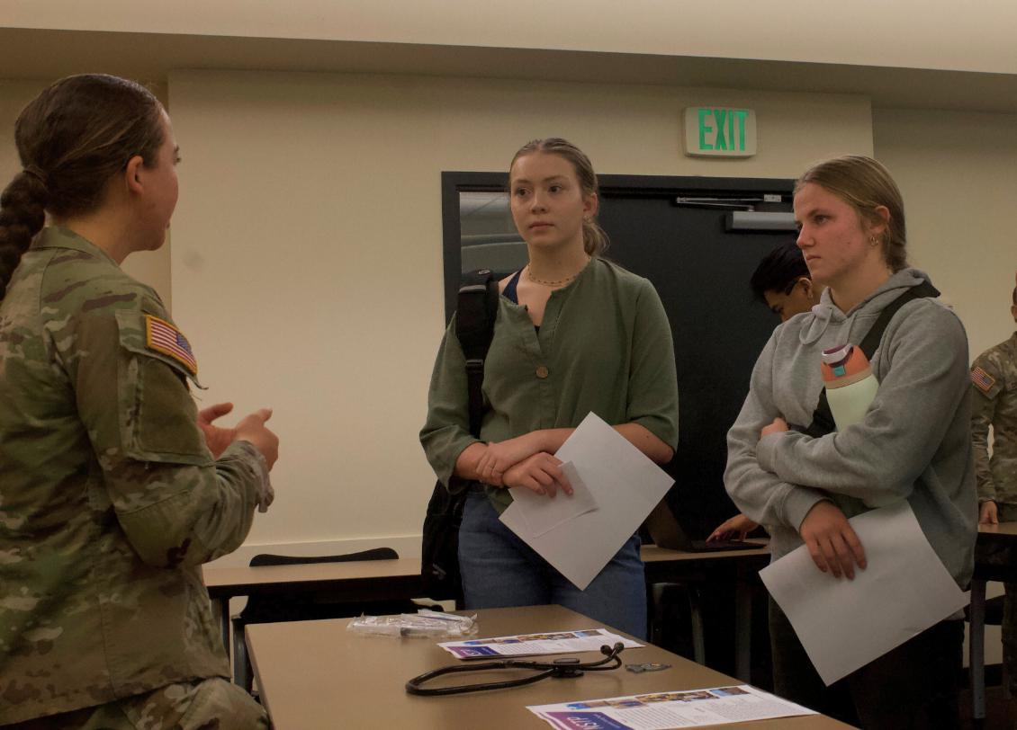 Cadet in uniform w/ 2 new Cadets regular clothes
