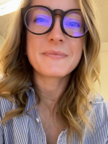 Woman facing camera with glasses