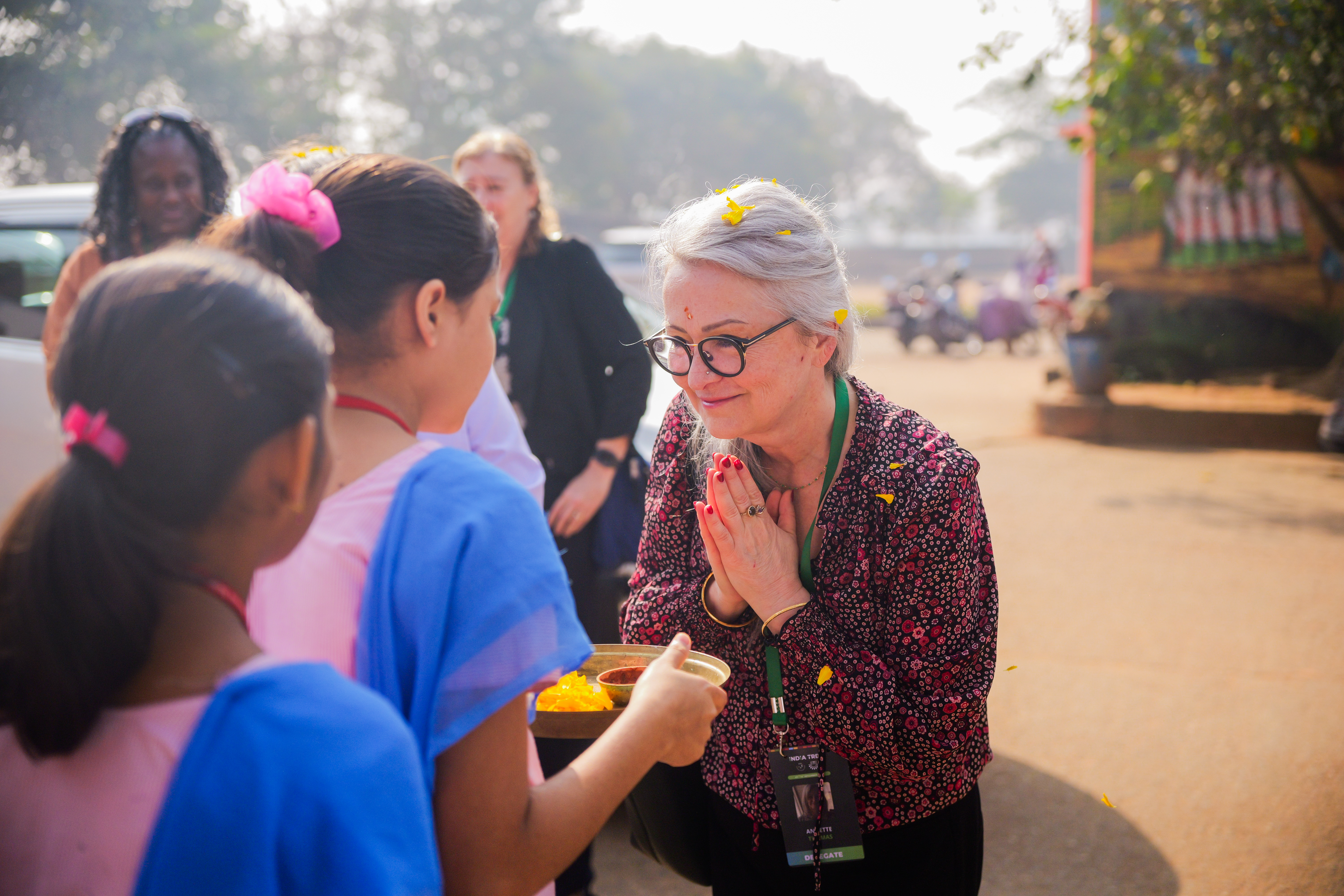 Annette Thomas greets students at KISS