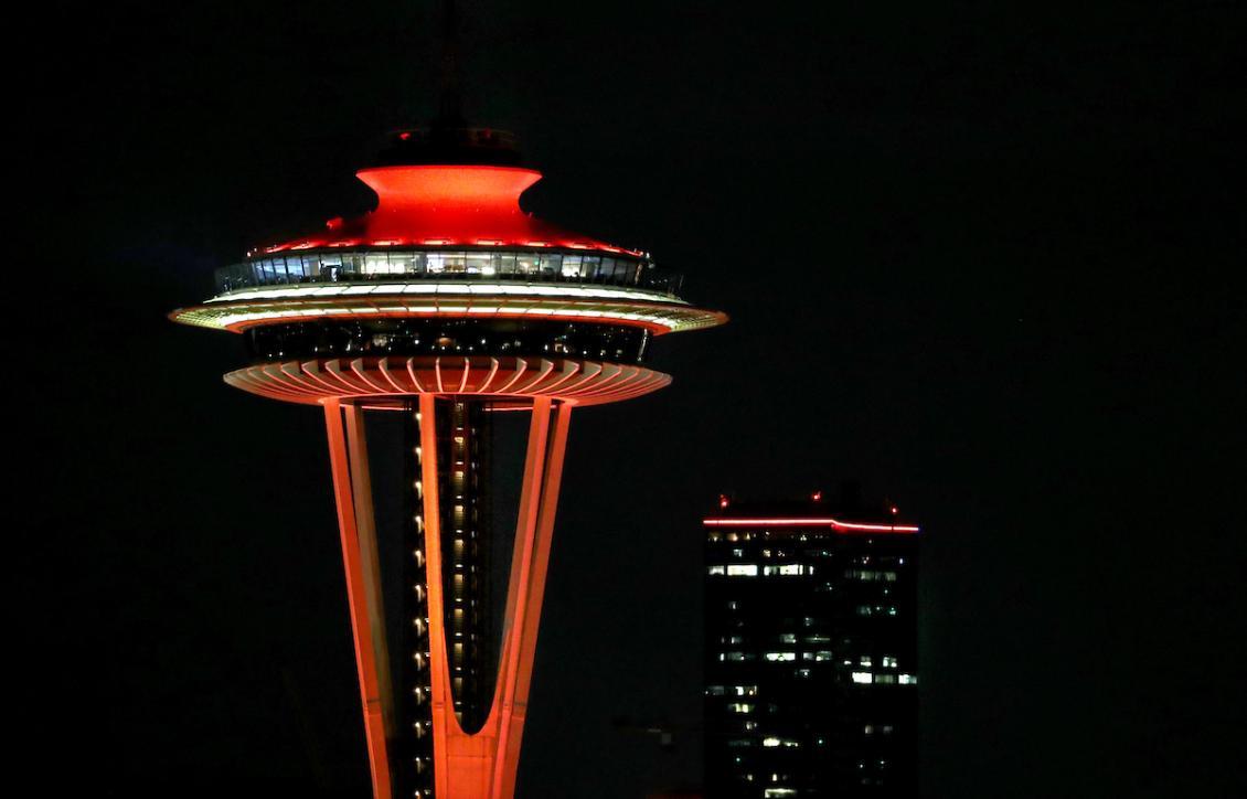 Feature image of the Space Needle lit up in Redhawk Red