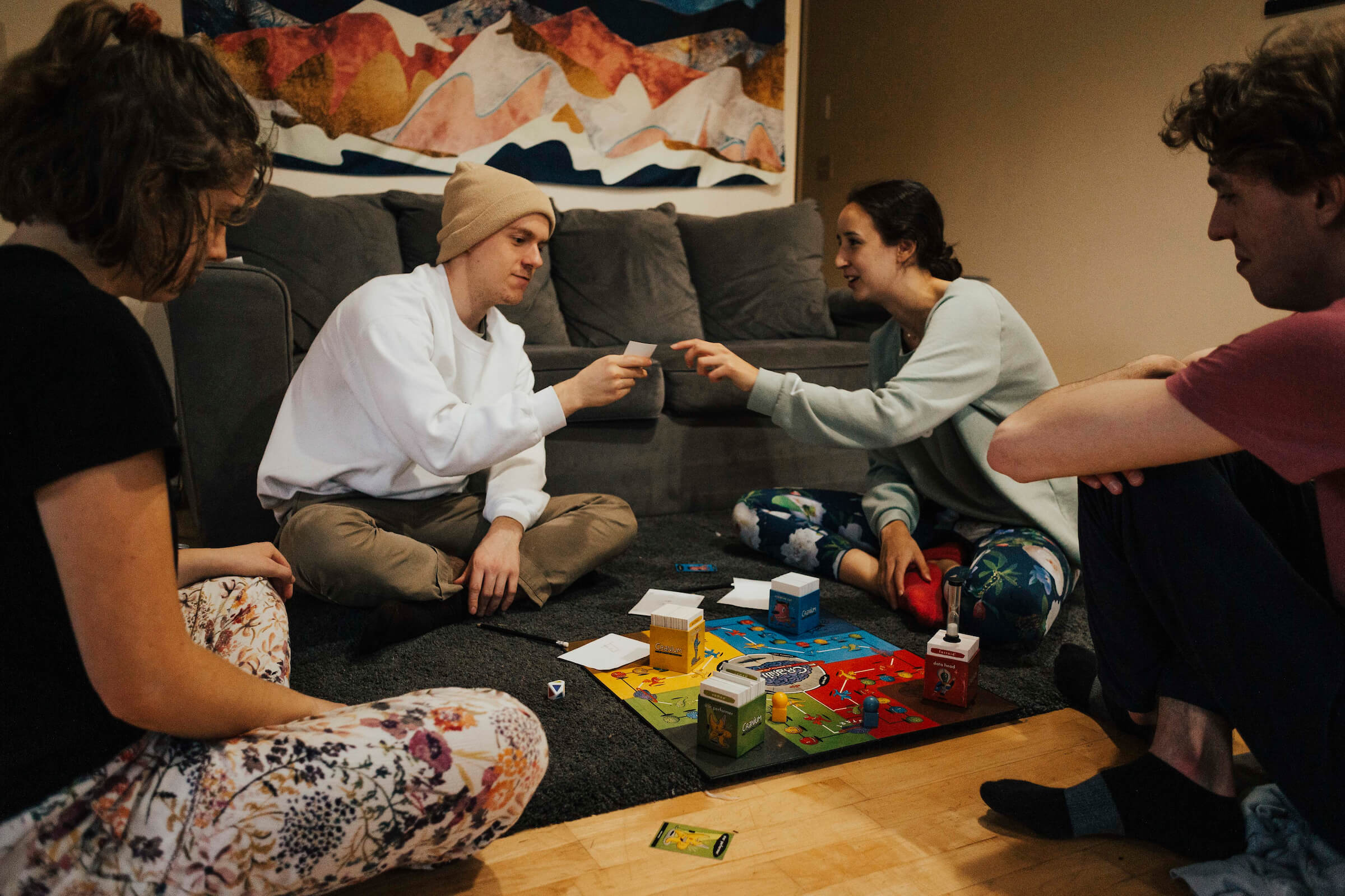Hallie and her 3 roommates have a game night together at home