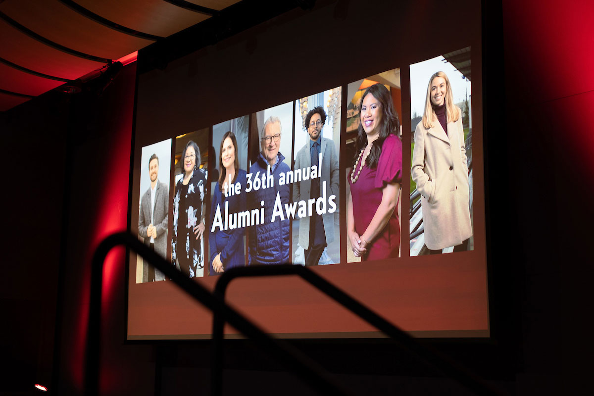 A projection screen featuring this year's winners.