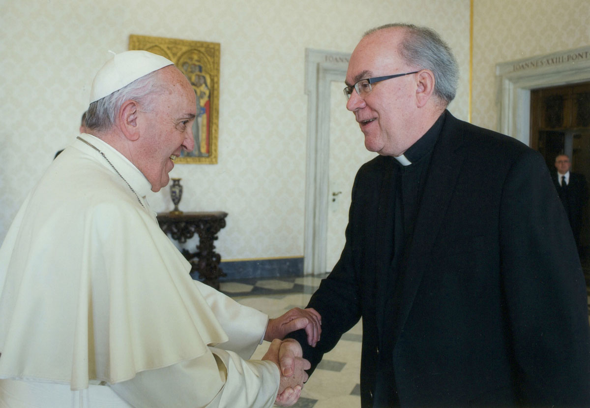 Fr. Sundborg shakes hands with Pope Francis