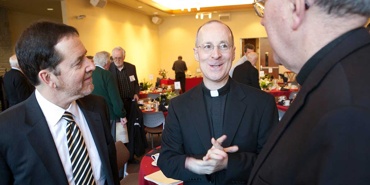 Fr. James Martin S.J. (center), STM dean Mark Markuly (left), Fr. Steve Sundborg