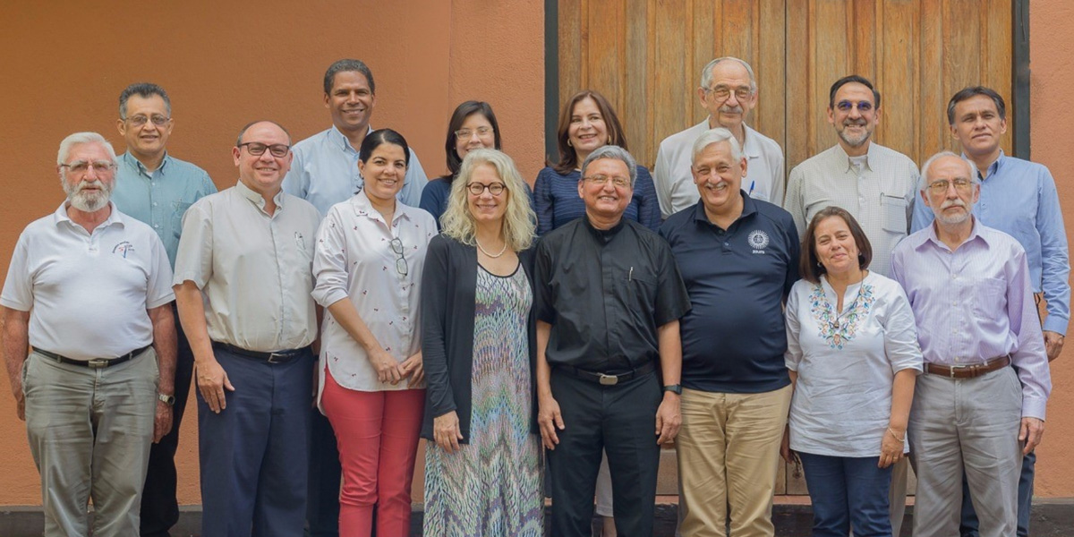 Serena Cosgrove, Father Chepe, Father Sosa, and members of the UCA Cabinet