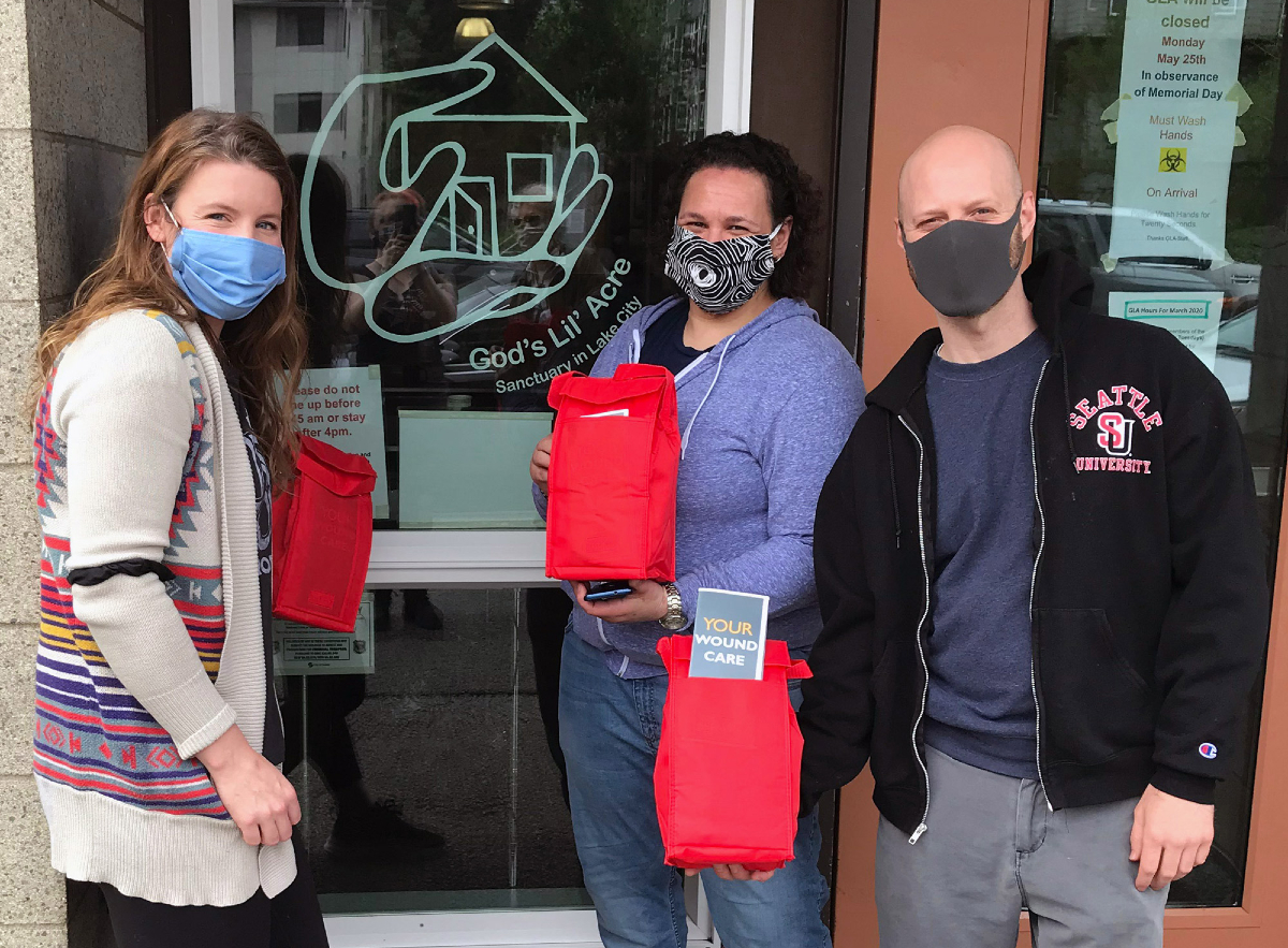 Pictured left to right: Sarah Dean, Jen Tate from God’s Lil Acres, and Brad Fifield holding wound care kits.