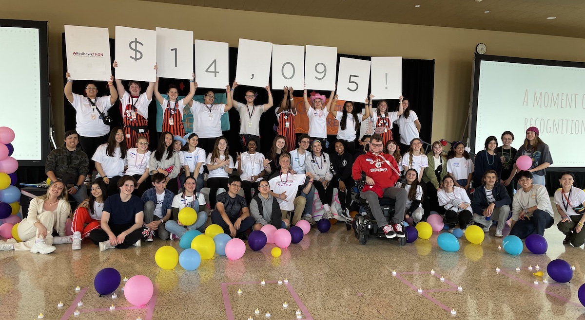 A celebratory photo showcasing how much money was raised at the RedhawkTHON.