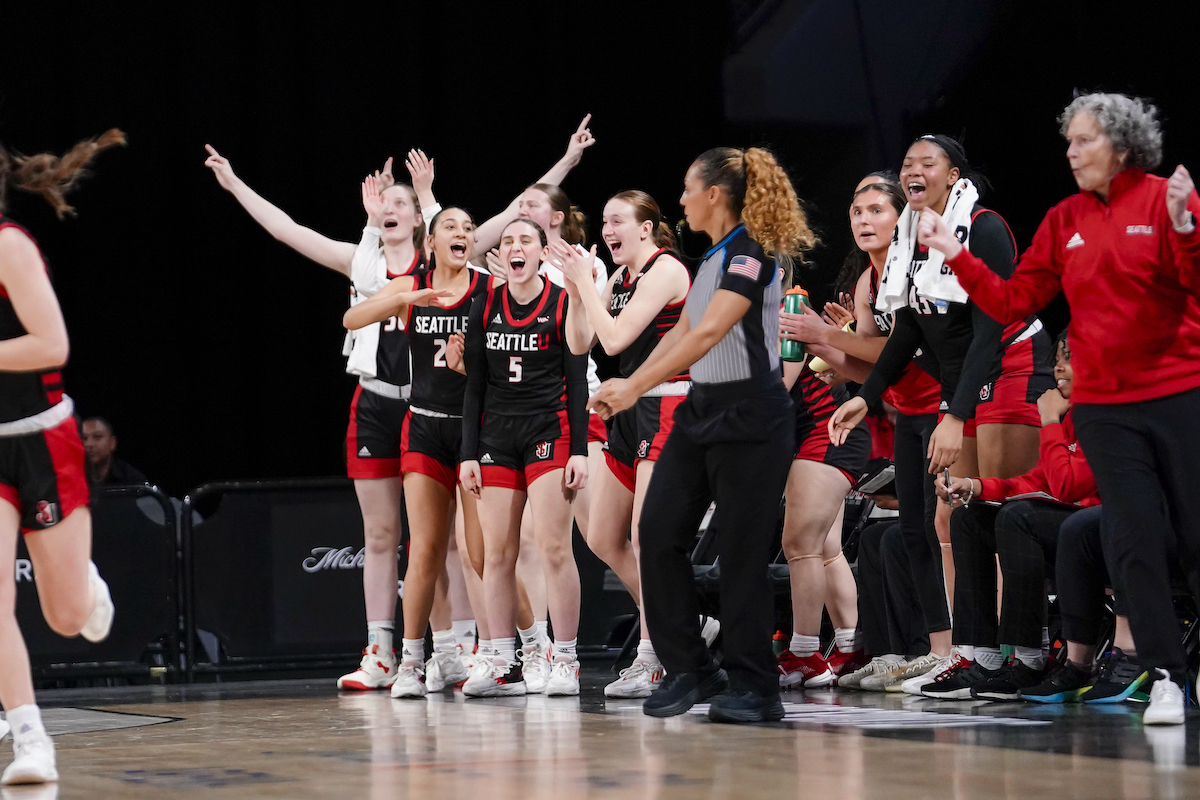 Women's basketball celebrates a historic win in the first round of the WAC tournament.
