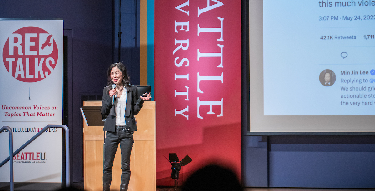 A photo of Sharon Suh on stage during February Red Talks.