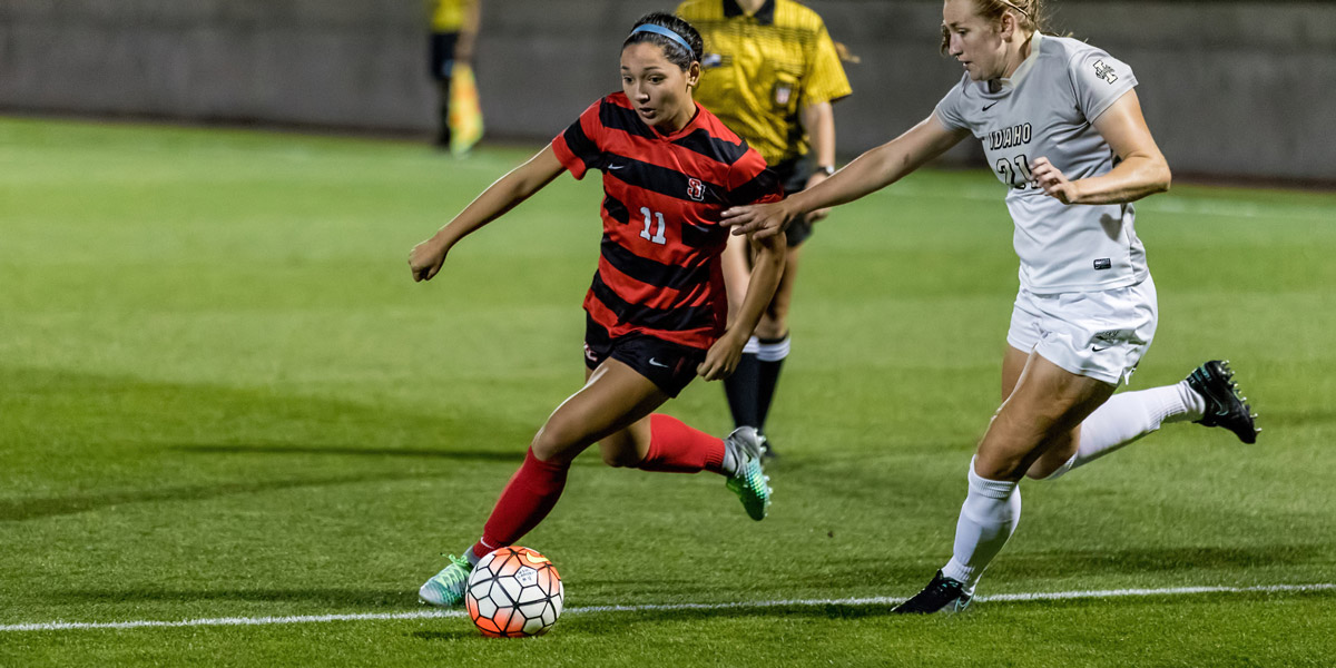 a player on SU Women's Soccer team with the ball