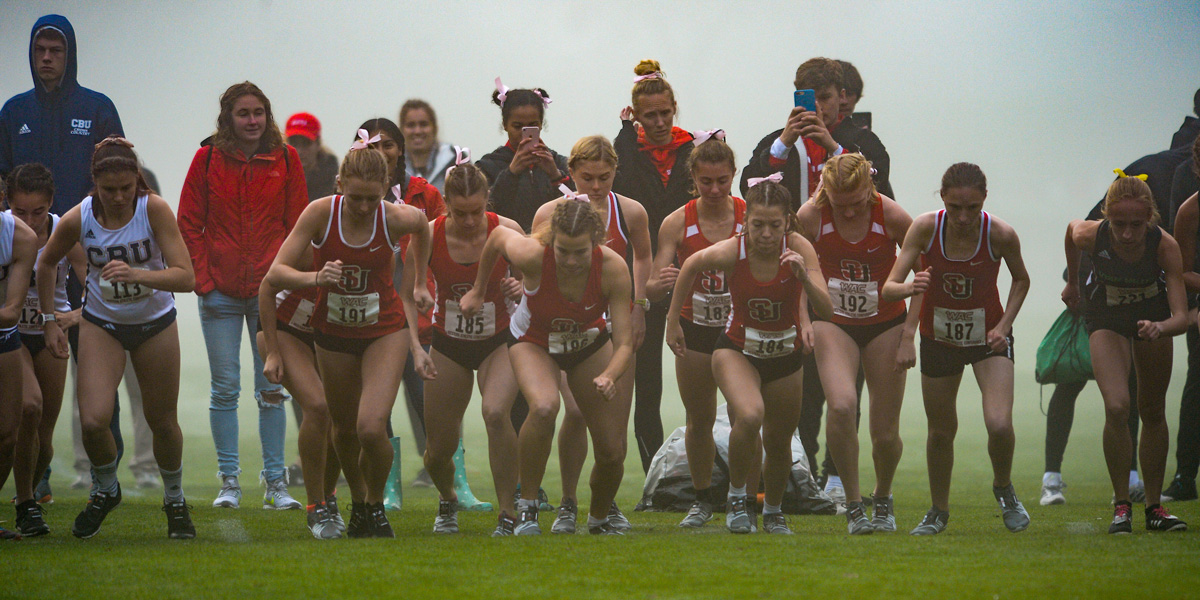 members of SU Women's Cross Country Team taking off in a race