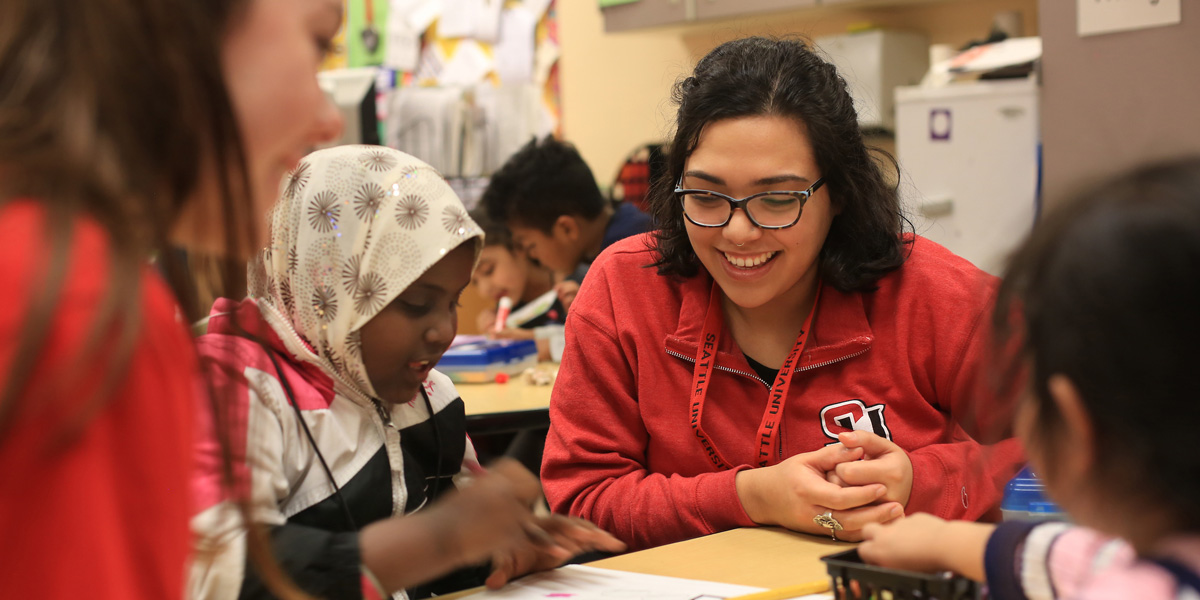 Seattle University students working with Bailey Gatzert Elementary School students as part of SUYI