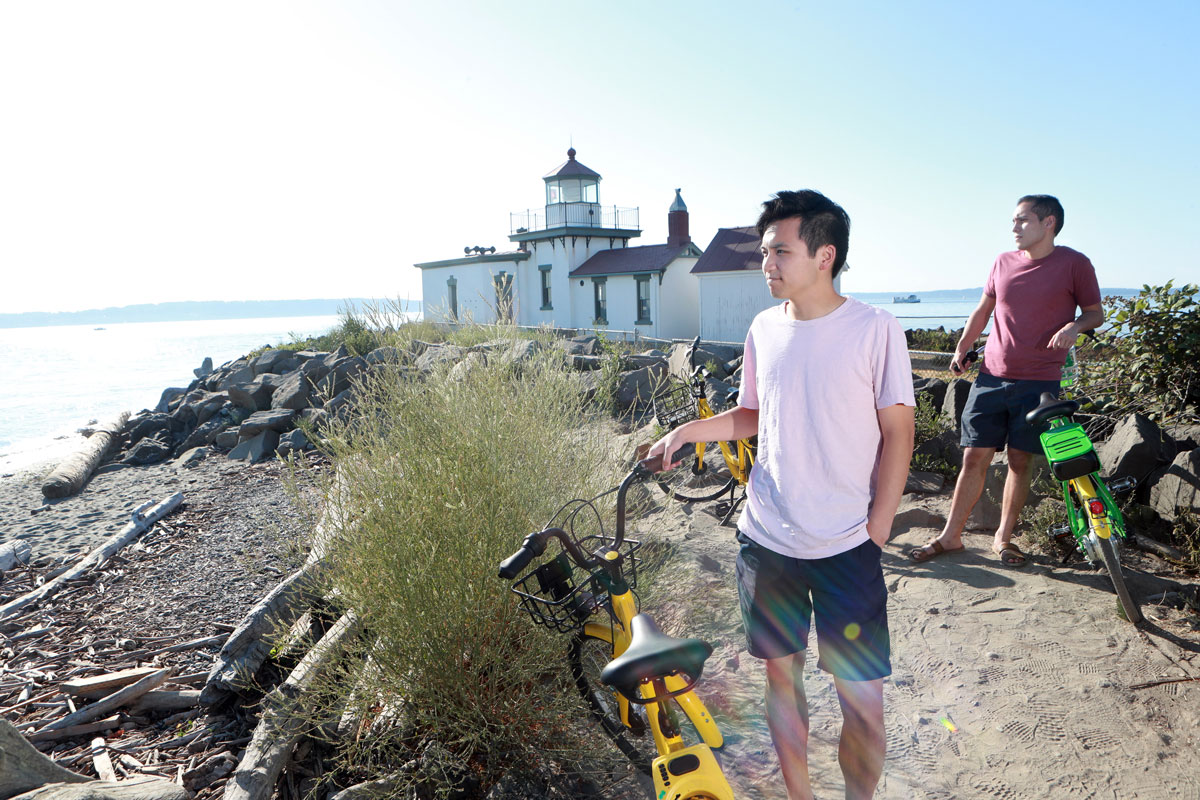 Two Seattle University students at the view at the West Point Lighthouse in Discovery Park.